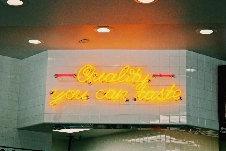 neon sign mounted on the wall of a building