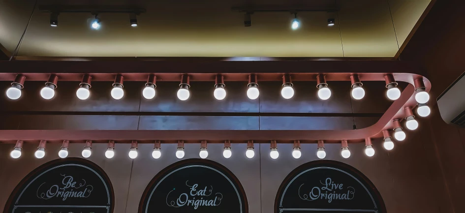 three chandeliers that are suspended from the ceiling