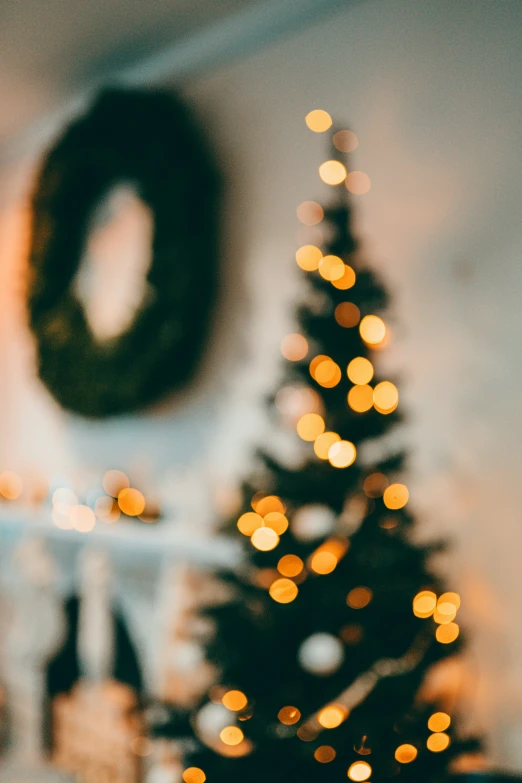 a blurry po of a christmas tree with bright lights