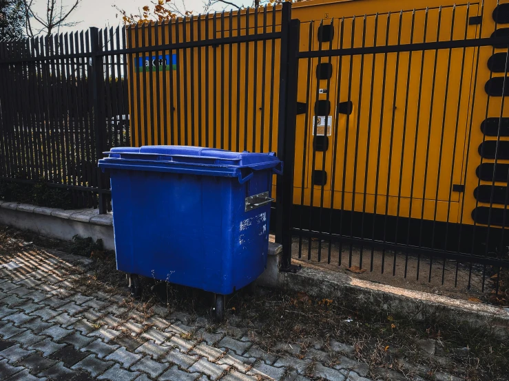 two yellow and blue fences, with one red and the other blue and white