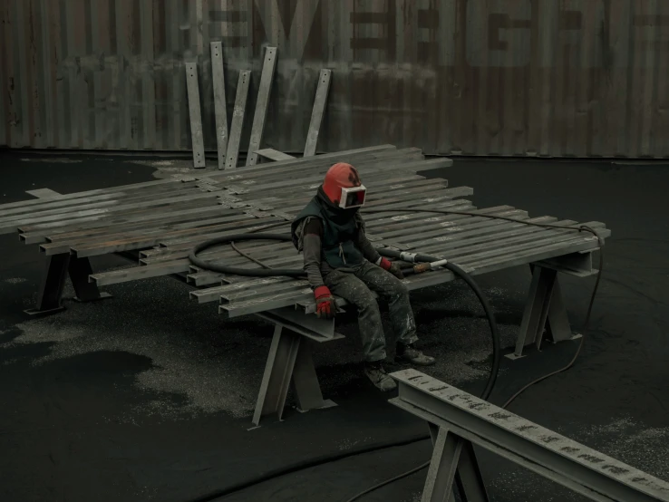 a man wearing a safety suit sitting on top of a bench