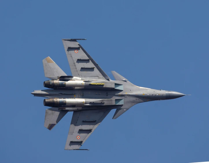 two fighter jets flying against the blue sky