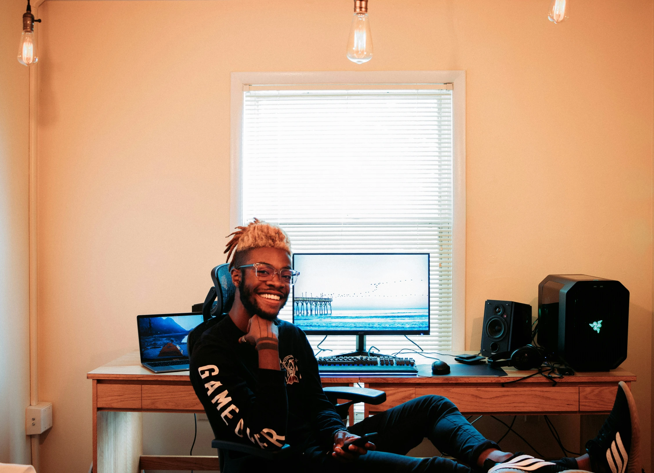 man talking on a cell phone while sitting in an office