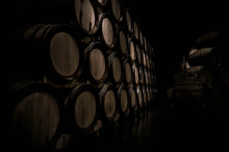 many barrels in a dark room with lights