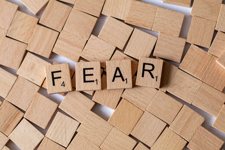 wooden blocks that spell out the word fear