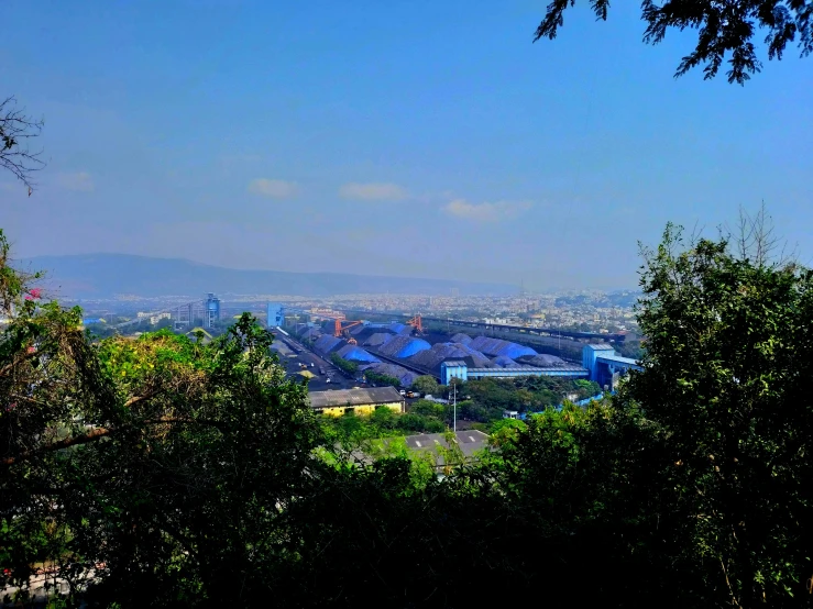 an incredible picture of some buildings seen through the trees