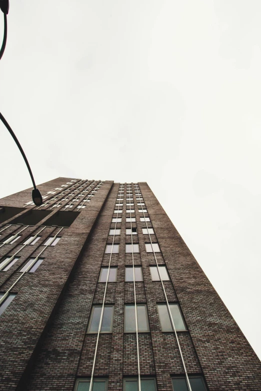 the top of an old tall building with lots of windows