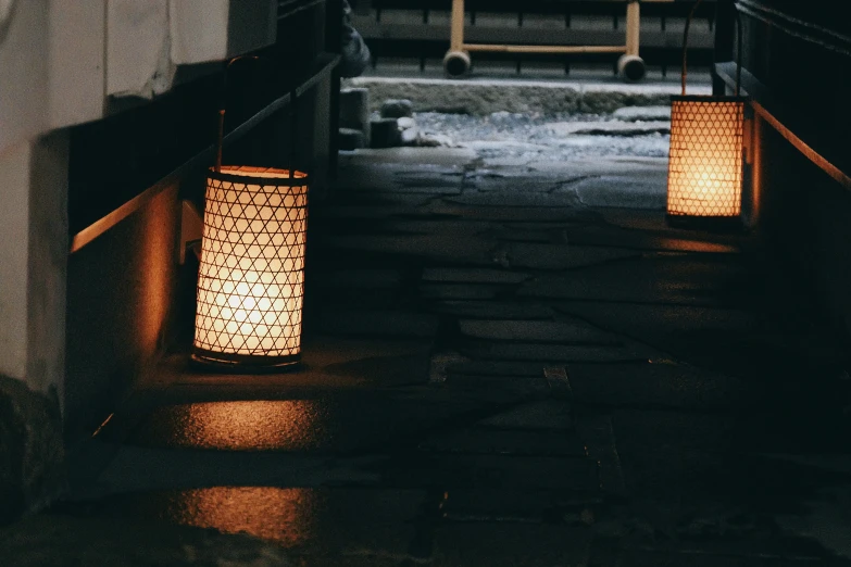 three lanterns that are sitting in the street