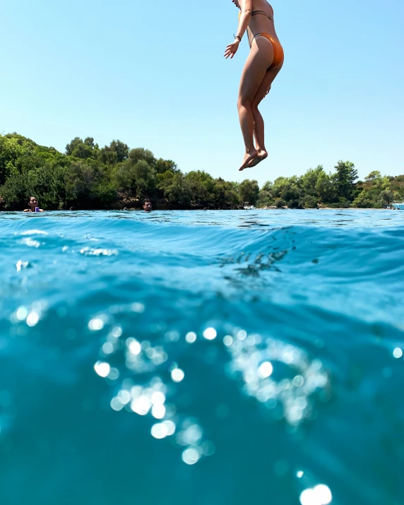 a person jumping in the air while surfing