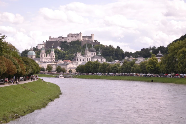 a river runs through a city by some houses