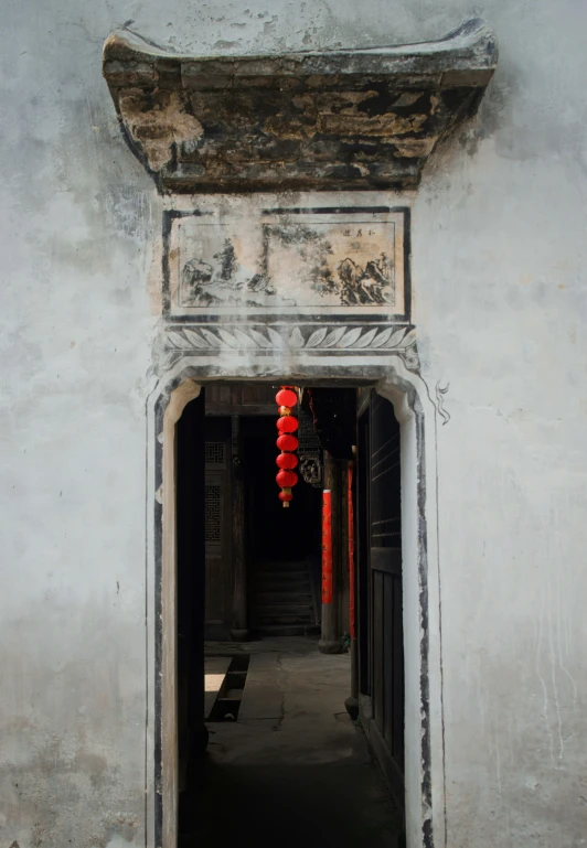 an arched doorway leading to an open hallway