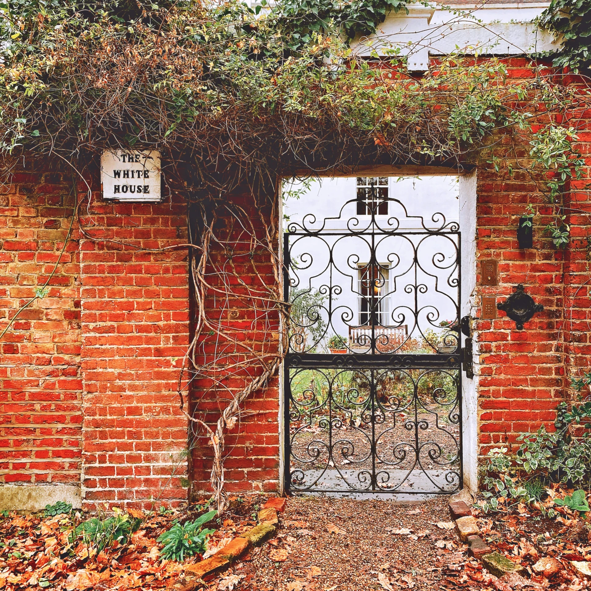 a iron gate in an old brick building