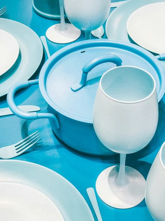 blue and white table setting with blue table cloth