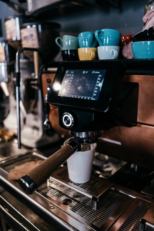 espresso machine in coffee shop with coffee cups and other things