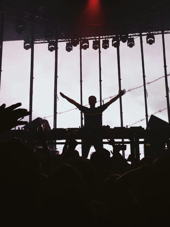 a person is standing in front of the stage at an event