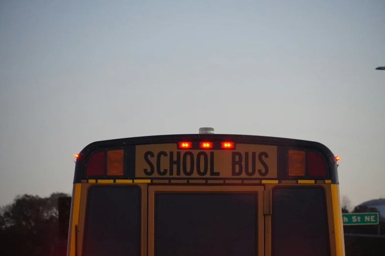 a back view of a school bus parked