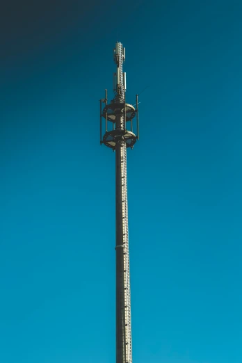 a tall pole with a large white clock on top