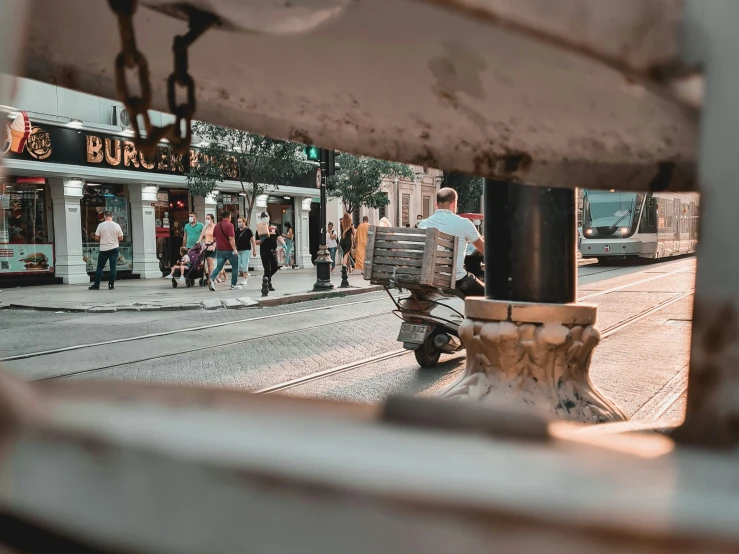 a view of a street from a store window