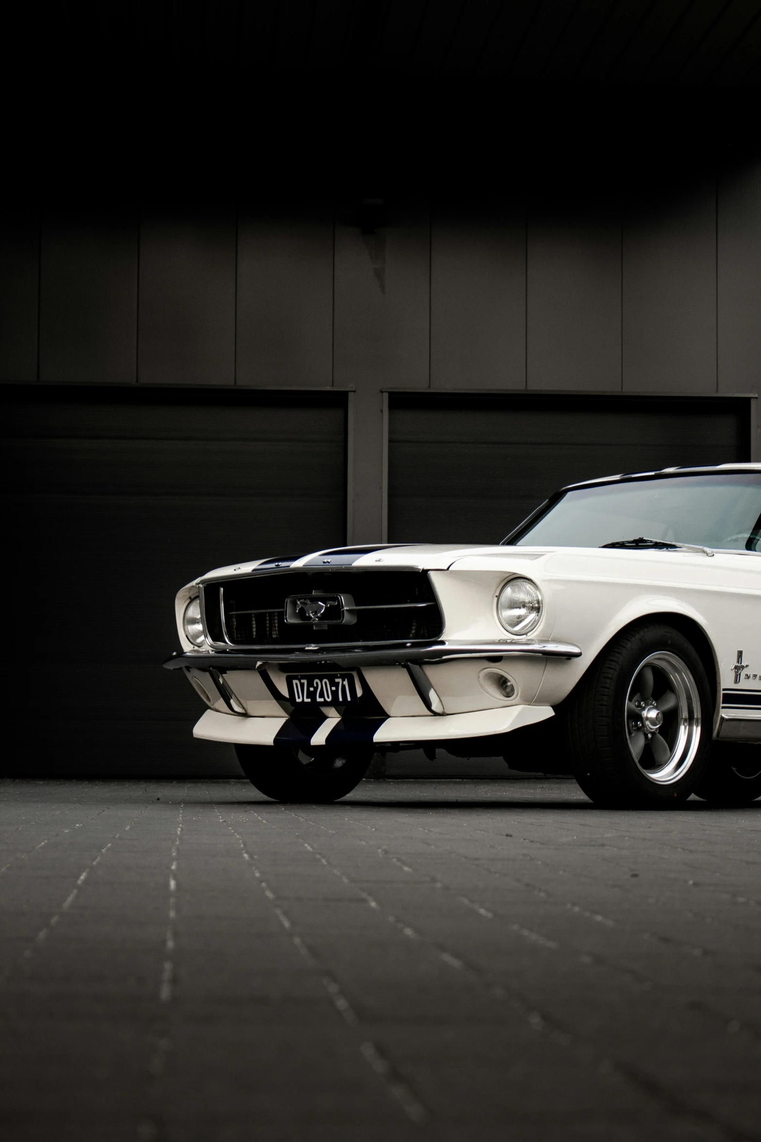 an old mustang sports car in a garage