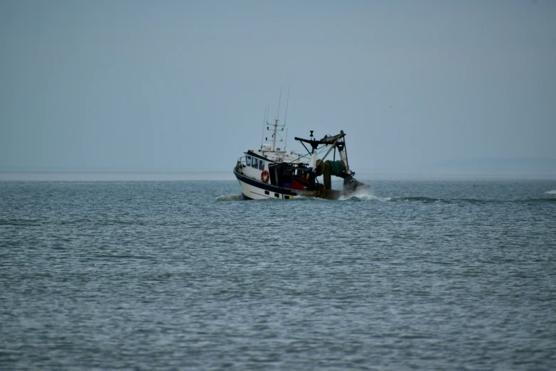 two boats are close to each other in the ocean