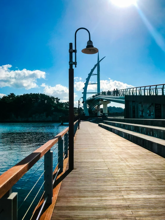 a wooden walkway that is next to water