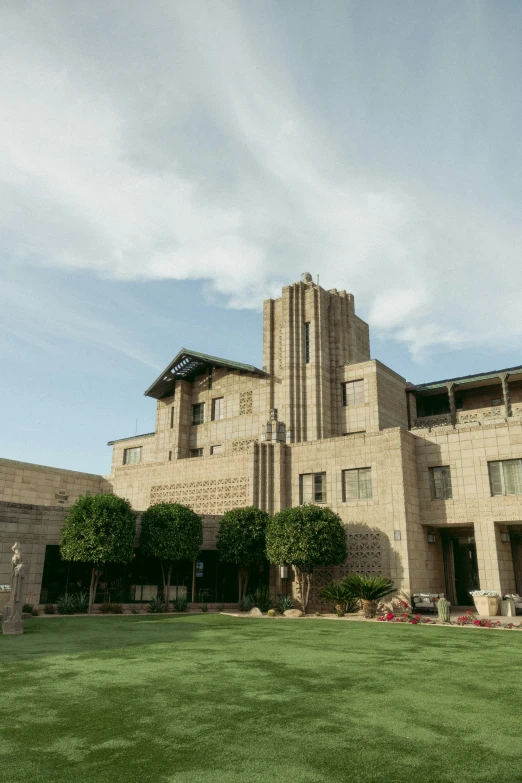 a large building on top of a grass field