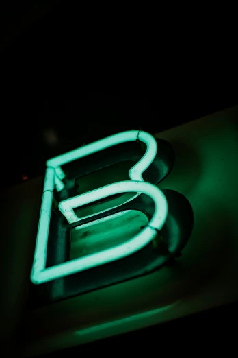 glowing neon sign of the letter b
