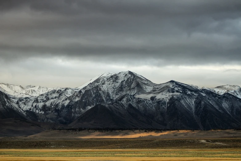 there is a snow capped mountain in the distance