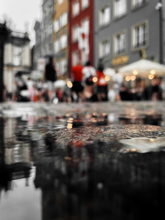 umbrellas are sitting on the sidewalk in the rain