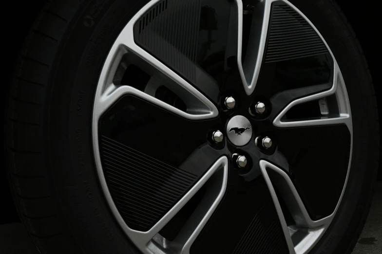 a black wheel on the front of a car