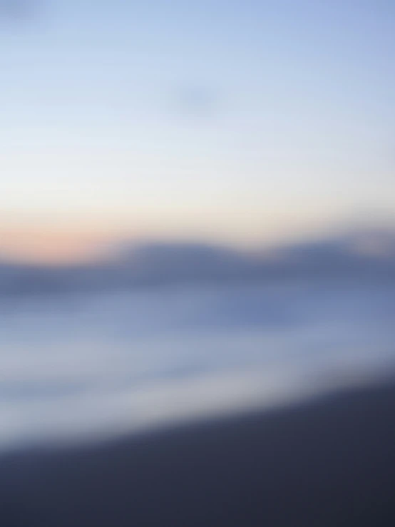 blurry, abstracted po of the ocean at dusk