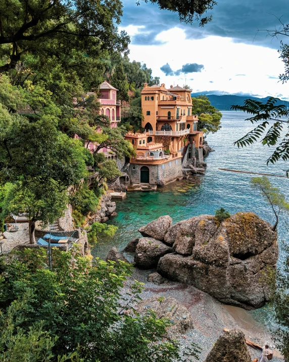 a scenic view of a castle, building, and water