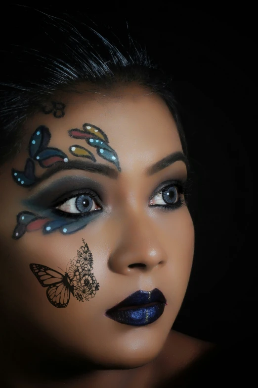 a woman with makeup art painted on her face