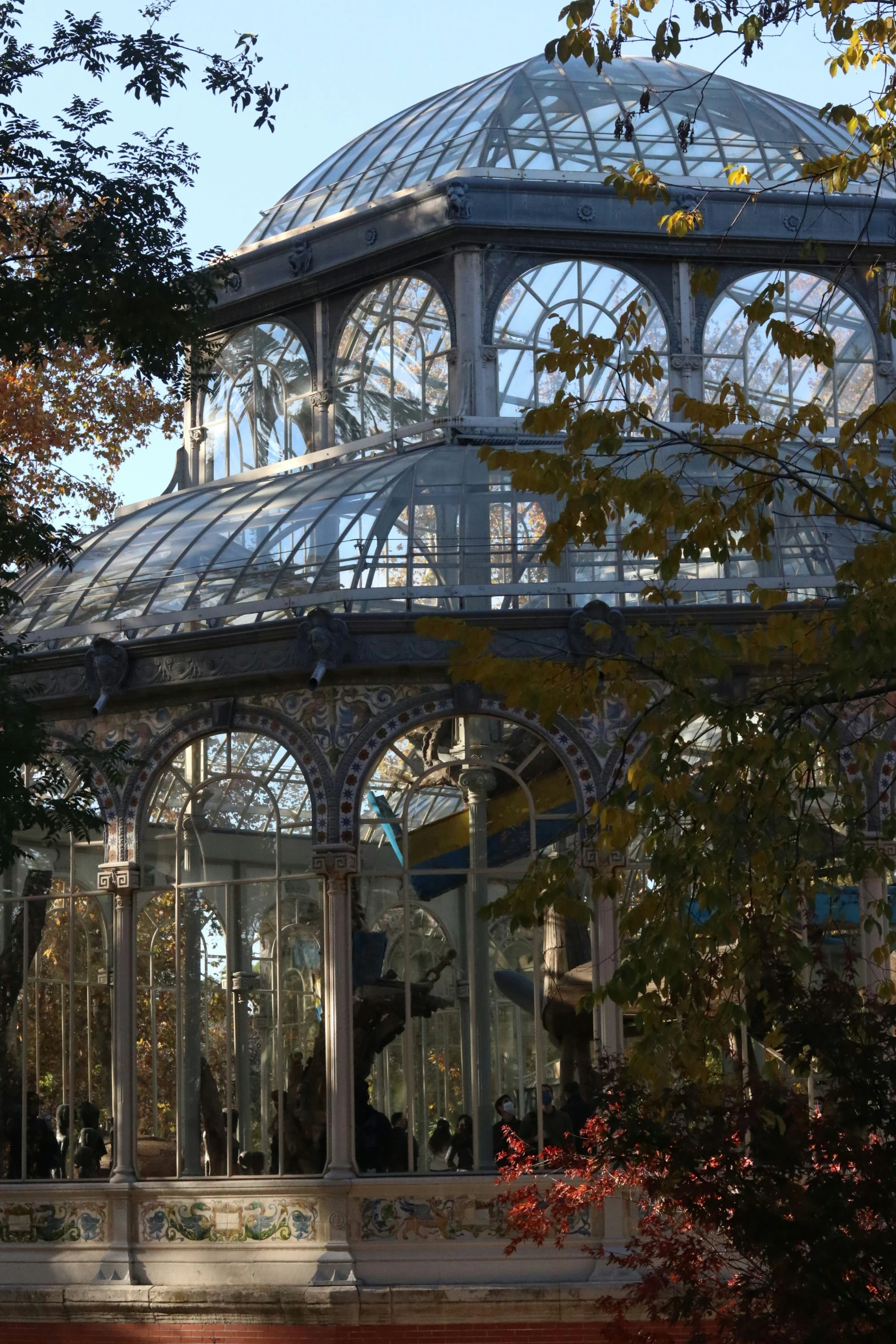 a large glass building with many windows inside