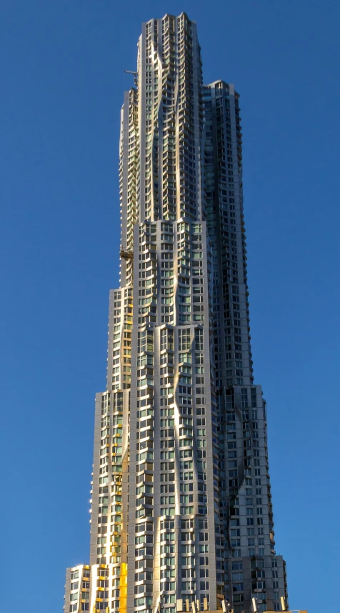 tall building with gold and green decorations on it