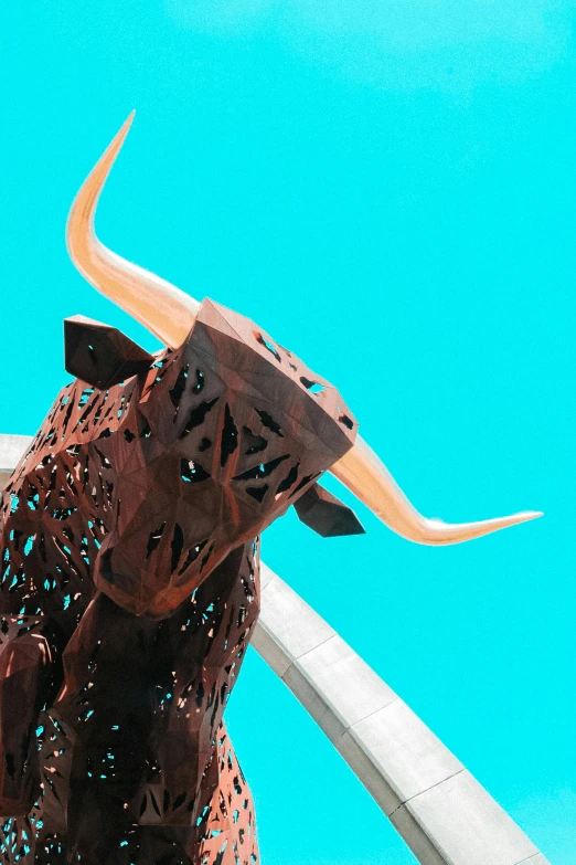 a sculpture of an animal with its horns out