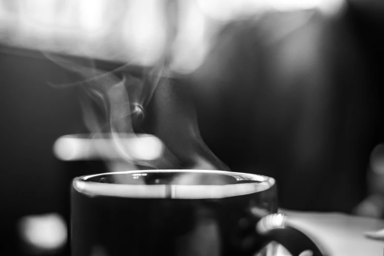 a cup with steam rising out the top