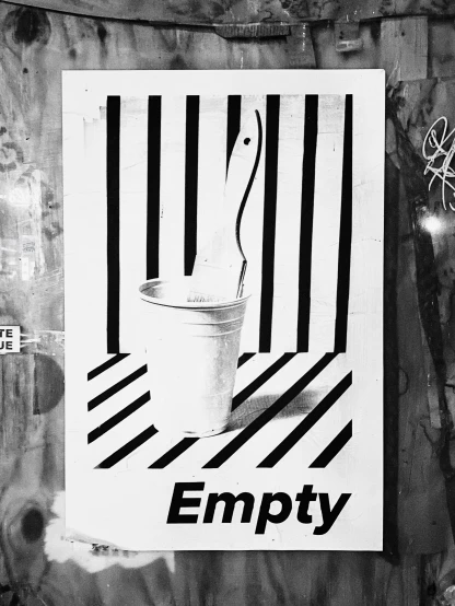 an empty bucket and a sign in a door