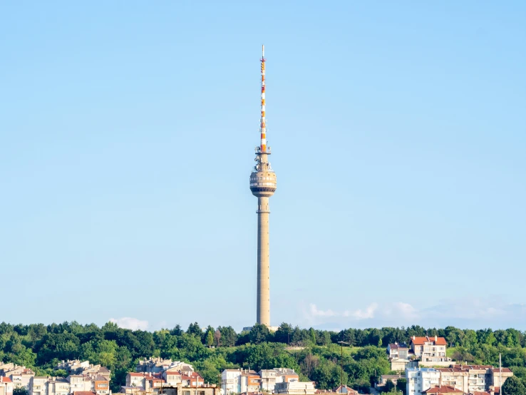 a tower in the distance with buildings near by