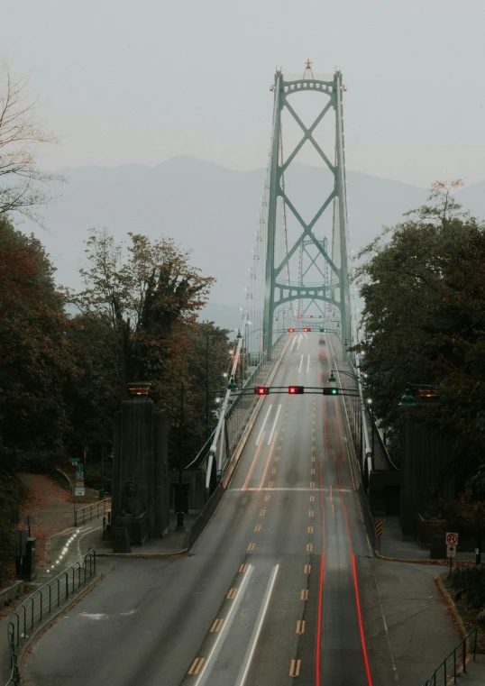 a view of a bridge from a distance on a cloudy day