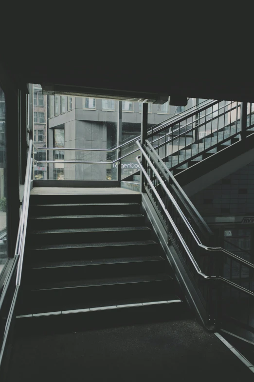 there is an escalator in front of some buildings