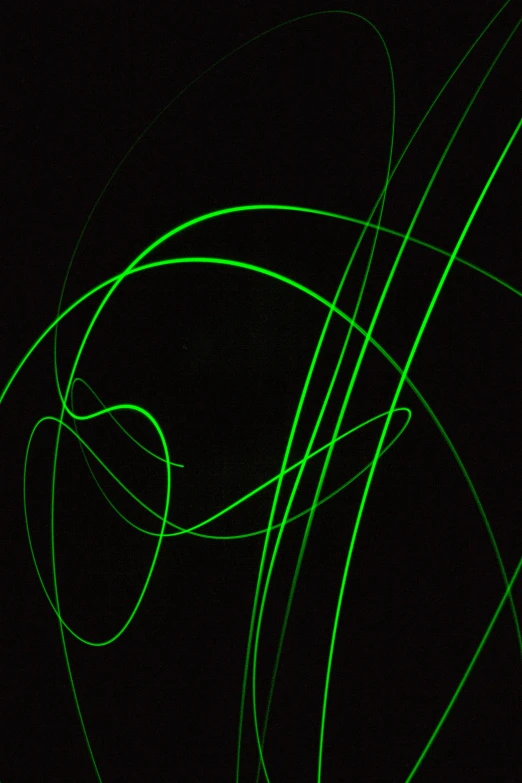 the word green glowing in front of a black background