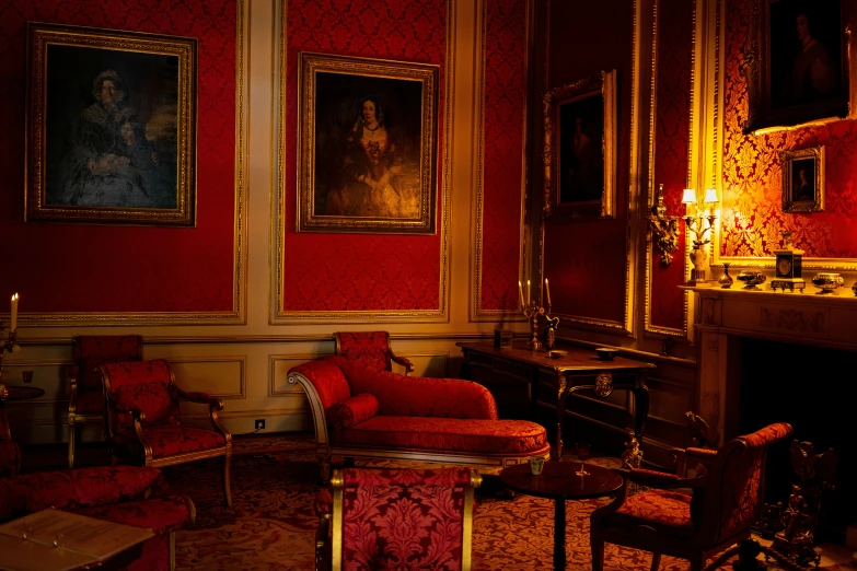 this is a living room with red walls and golden furniture