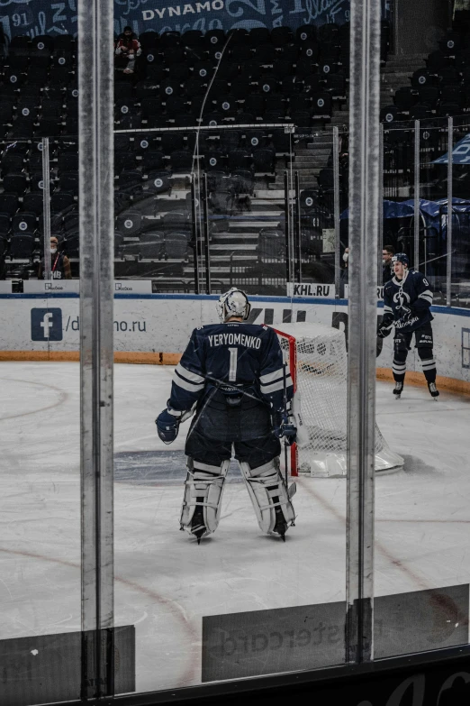 a hockey goalie gets ready to block a s