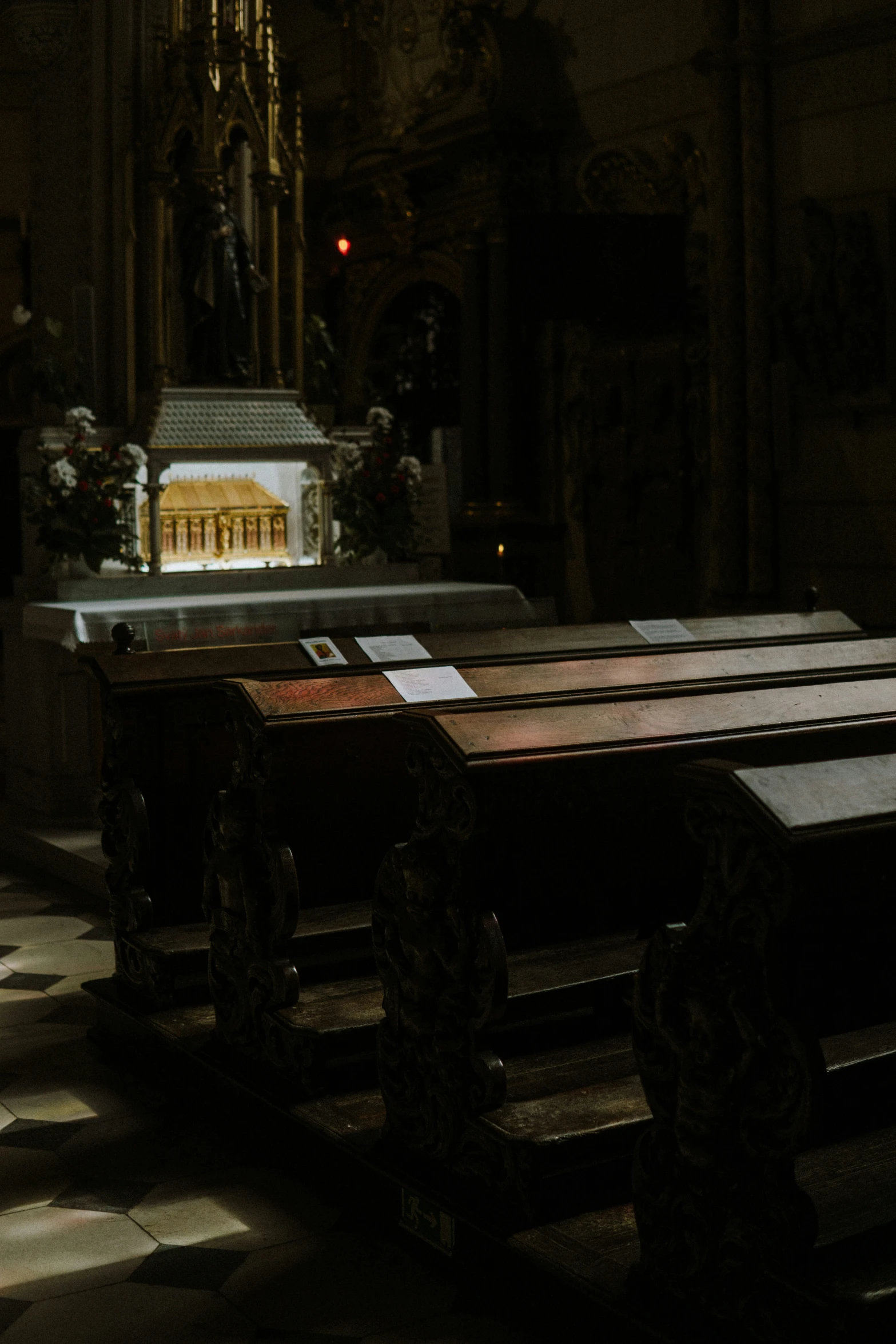 a very big pretty looking bench in a church