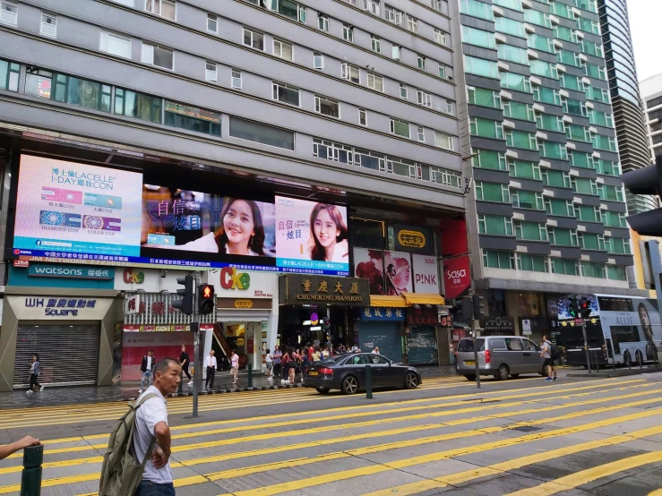 a big building that has several large signs on the side of it