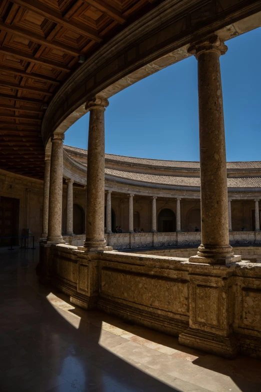 a large building has columns and arches