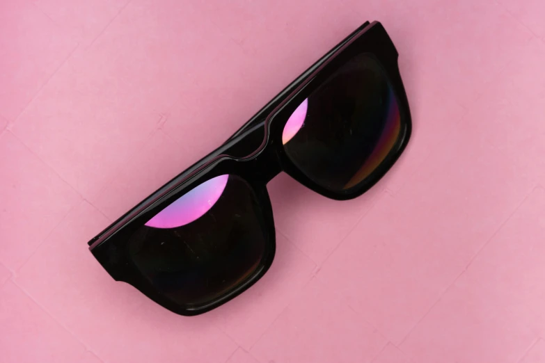 a pair of glasses with a pink mirror on it