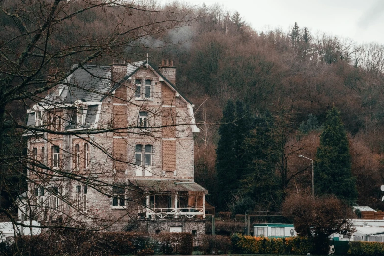 there is a building next to a forest