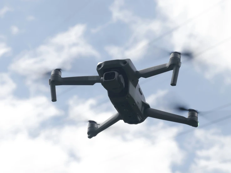 a black and white large camera flying through the air